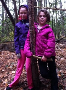 Isabel Hicks (left) and Megan Rivet make the acquaintance of a tree in Jackson Park