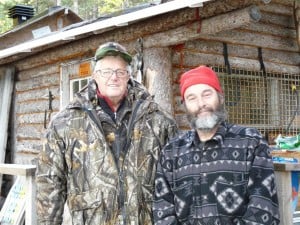 Raynald and Claude in front of the hunt camp 