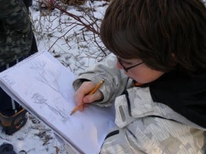 Student sketching in Edmison Heights Habitat Area - Drew Monkman